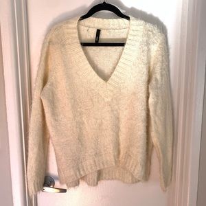 Fuzzy v-neck long sleeve sweater.